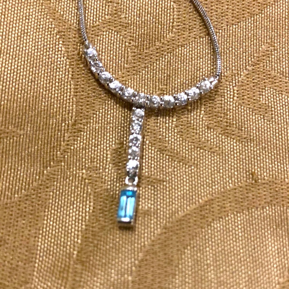 Lovely dainty pendant in silver with white and blue topaz cz stones